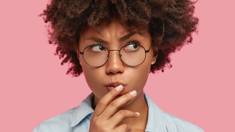 worried person touching their mouth