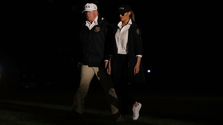 The Trumps arriving in Texas, with Melania wearing white sneakers