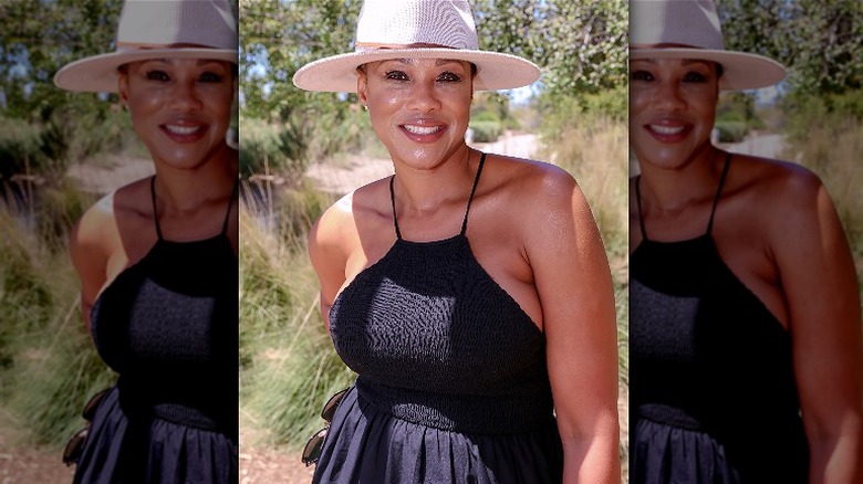 woman wearing black dress and hat