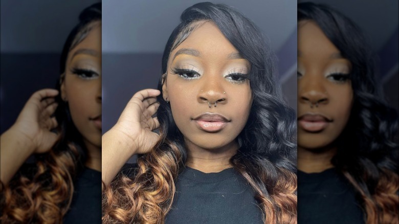 Black woman wearing silver smokey eye