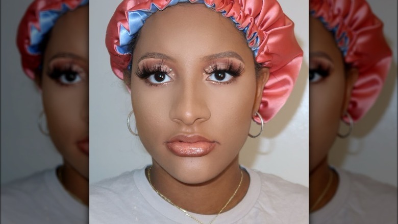 Black woman wearing pink glitter