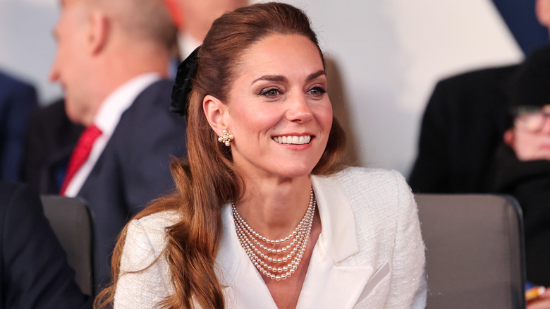 Kate Middleton smiles while attending the VE Day event in England