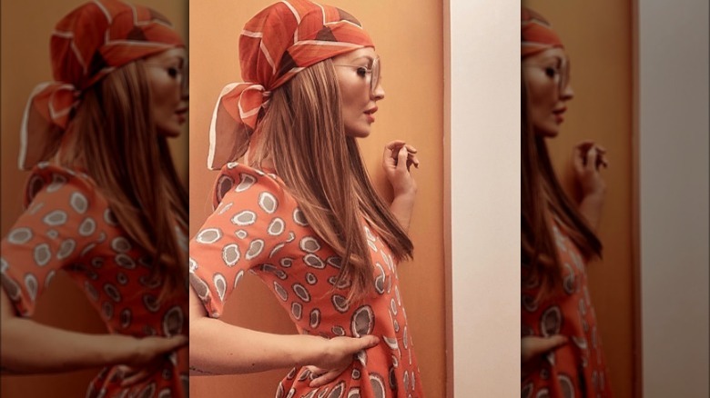 Woman in orange headscarf