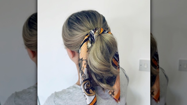 Woman with scarf in ponytail