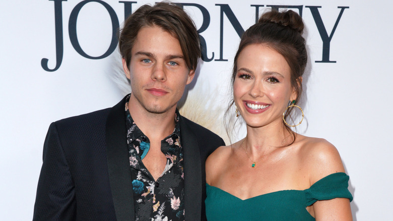 Jocelyn Hudon and Jake Manley pose together on the red carpet