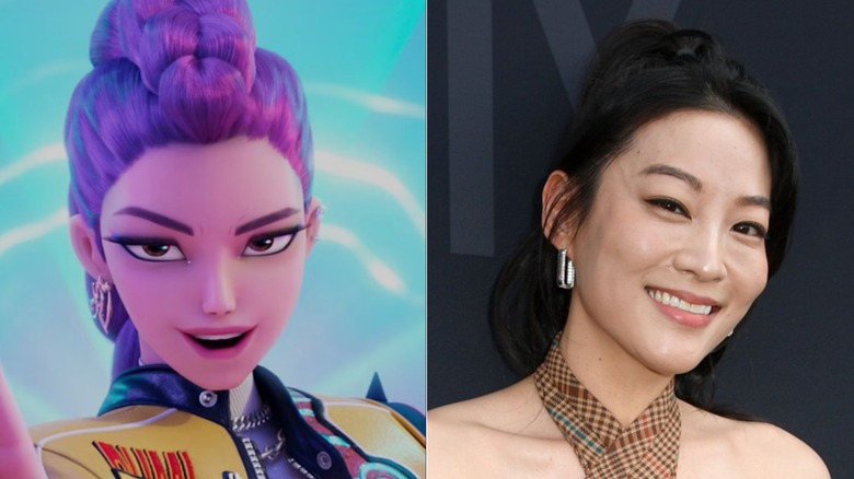 Rumi from "KPop Demon Hunters" and Arden Cho smiling on a red carpet