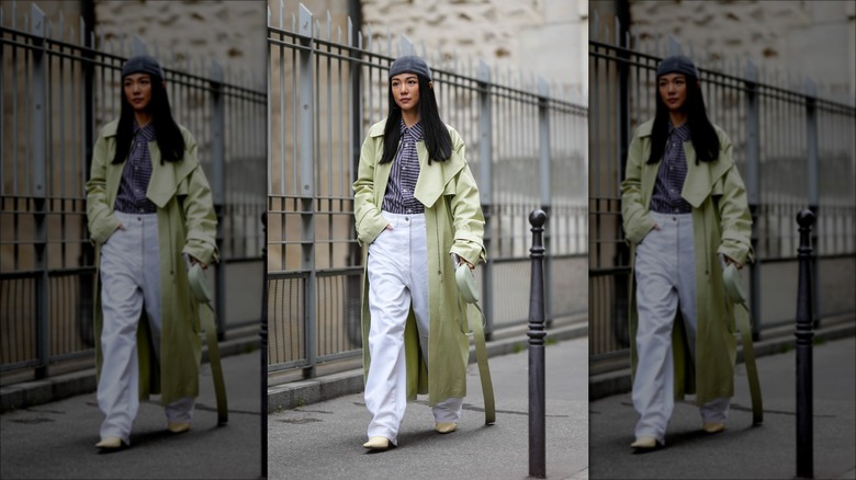 woman wearing green leather trenchcoat
