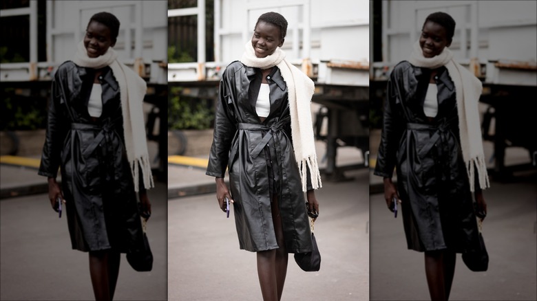woman wearing black leather trenchcoat