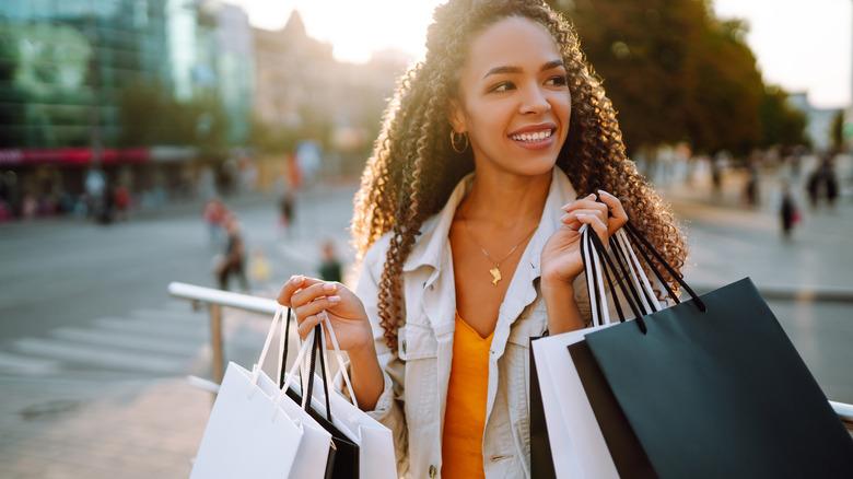 woman holding shopping bags