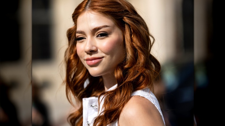 Redheaded woman in white dress