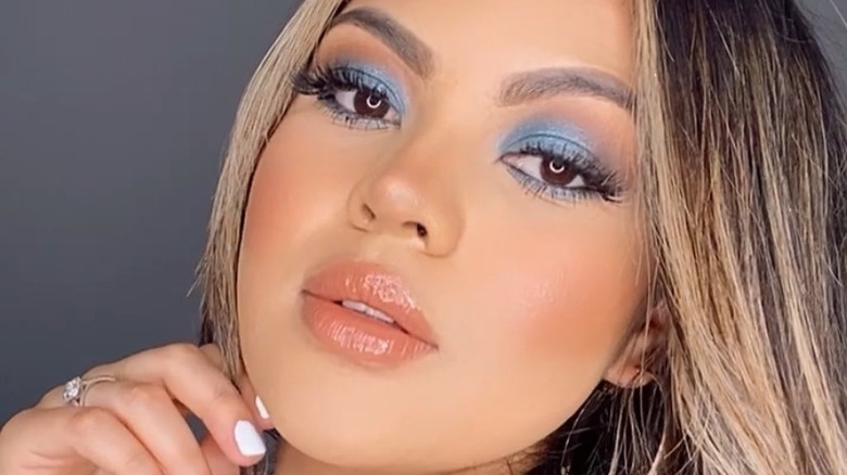 Coral lip and navy blue eyeshadow