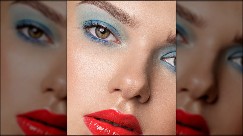 Blue eyeshadow and a bright red lip