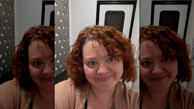 Madylin Sweeten smiling in a selfie with short copper hair