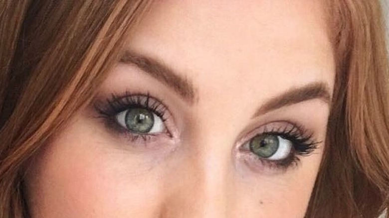 Girl wearing a slept in smoky eye