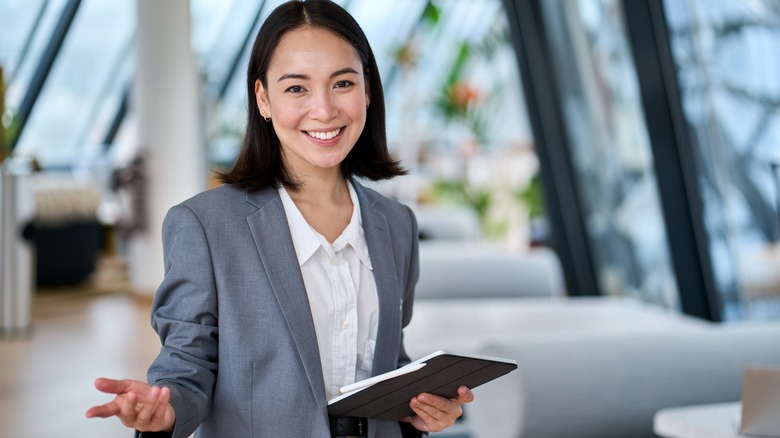Successful women poses in suit