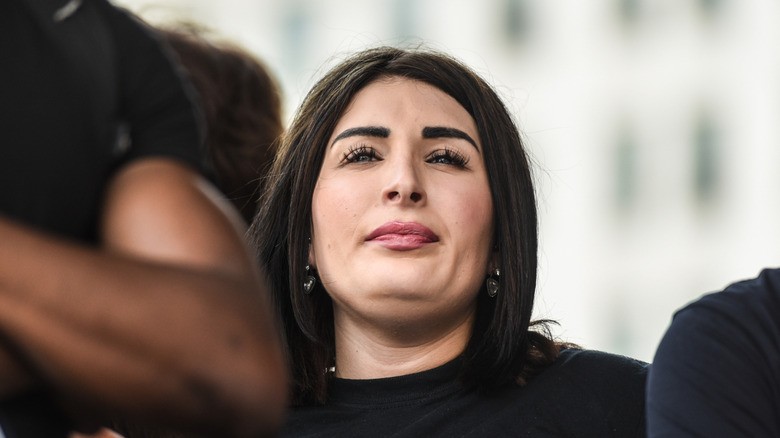 Laura Loomer wearing a black t-shirt