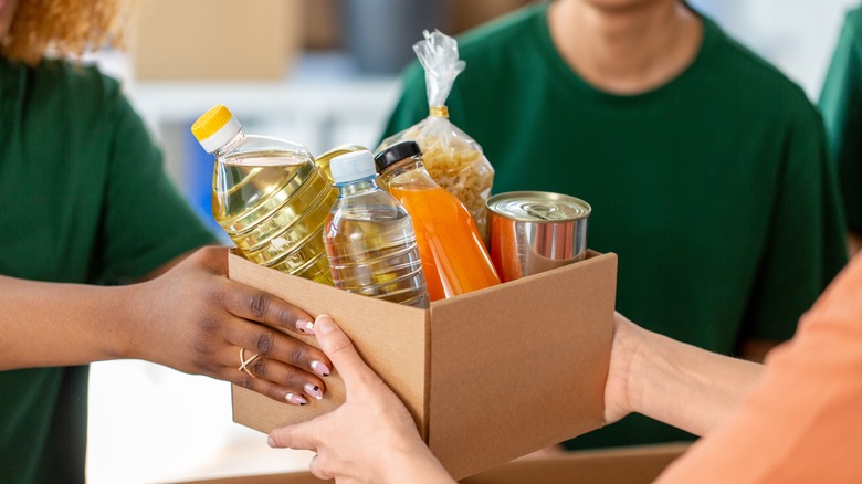 woman giving gifts to charity
