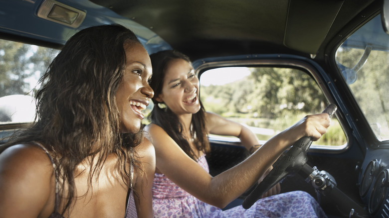Two girlfriends driving