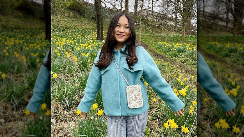 Woman carrying a phone pouch bag