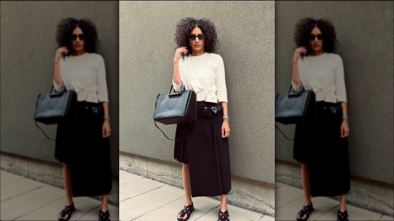 Woman in asymmetrical midi skirt