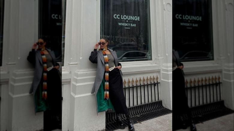 Woman wearing black midi skirt