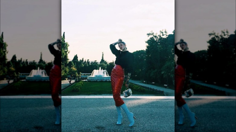 Woman in latex midi skirt