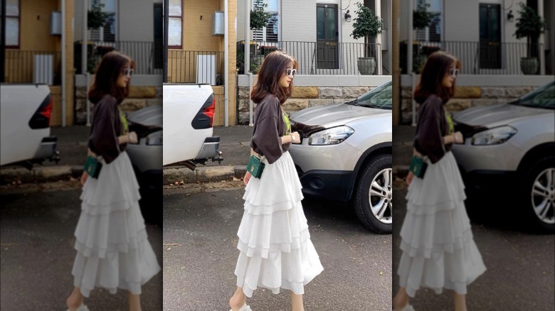Woman in white midi skirt