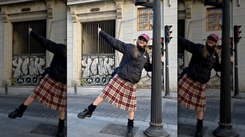 Woman wearing plaid midi skirt