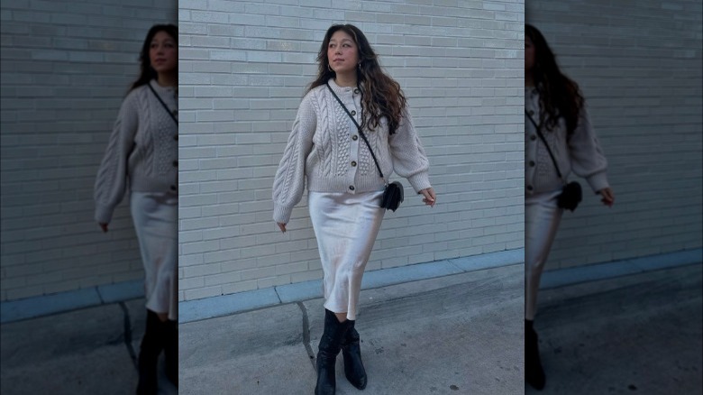 Woman in satin ivory midi skirt