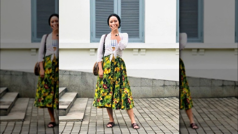 Woman in tropical midi skirt