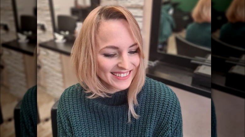 Woman models asymmetrical mid-bob