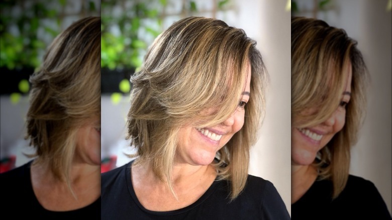 Woman models layered mid-bob