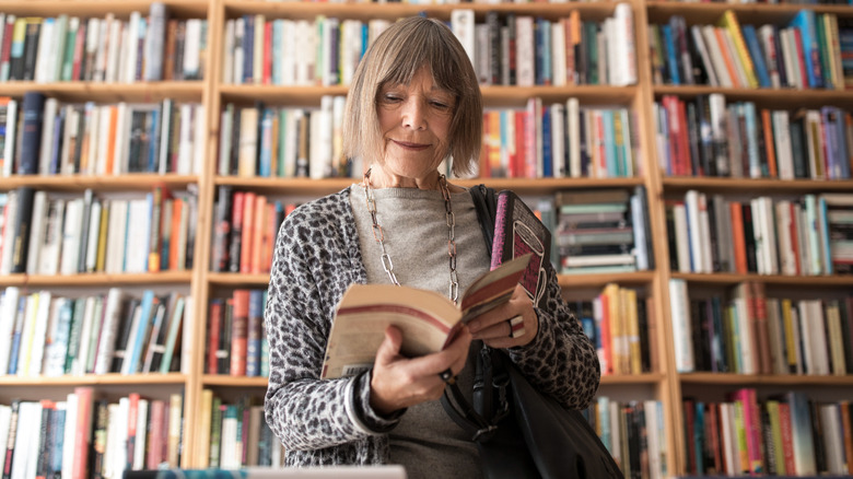 A woman reading in a bookstore