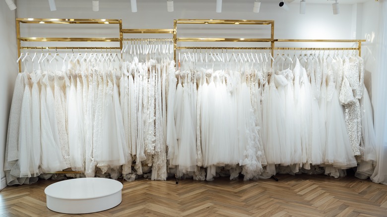 A collection of wedding dresses on the rack