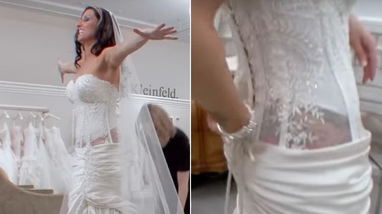 A bride tries on a corset-style dress at Kleinfeld's