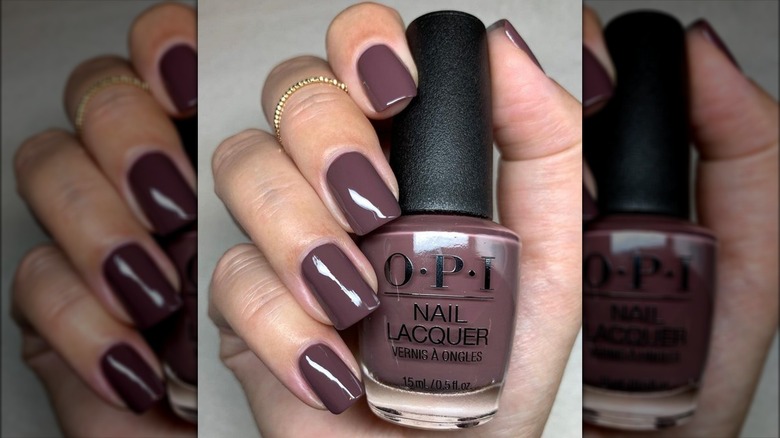 Hand holding bottle of nail polish