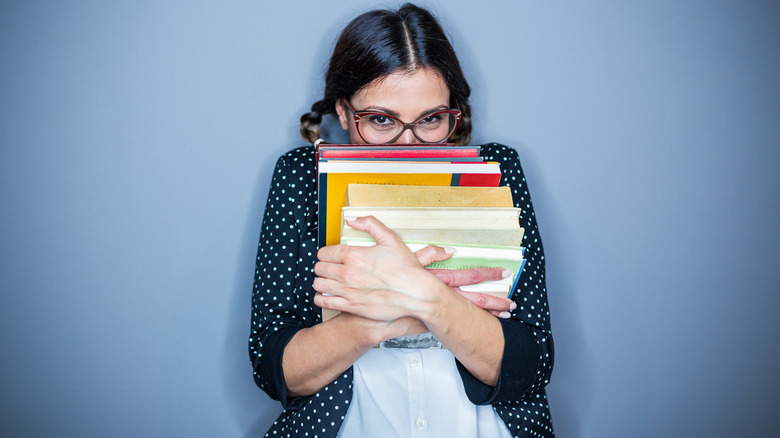 woman holding books