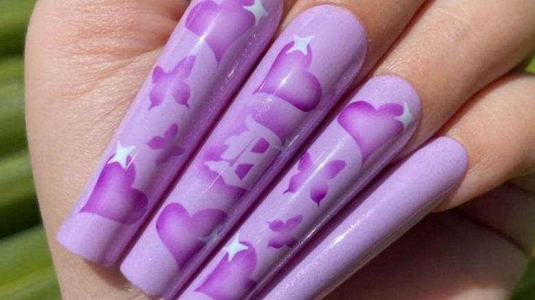 Purple airbrushed nails with hearts