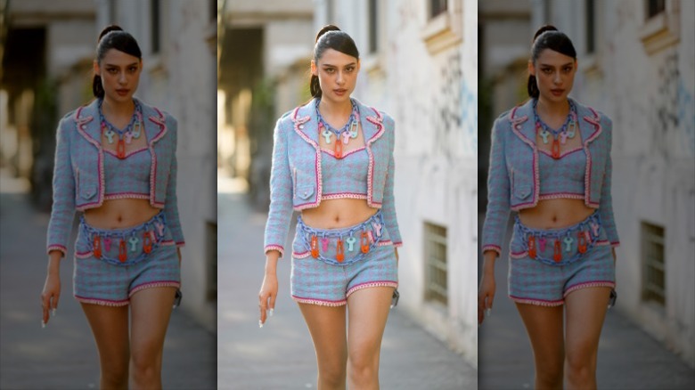 woman wearing a matching three-piece set 