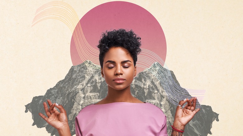 woman meditating near pink moon