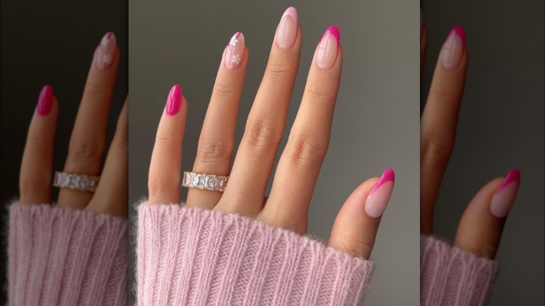 Hot pink almond nails with flower accents