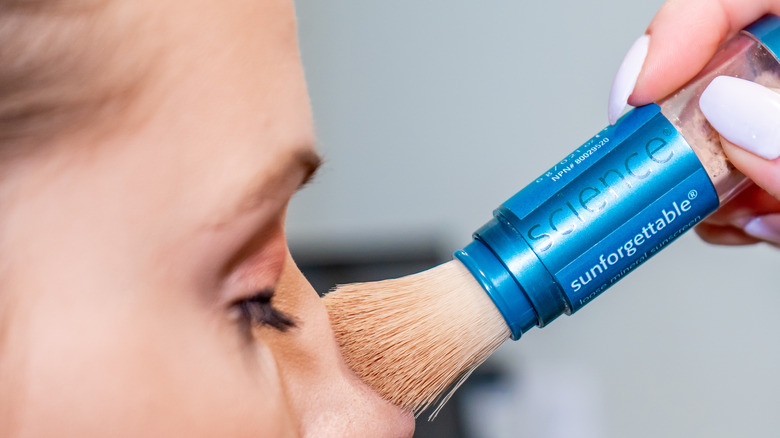 Model applying powdered SPF