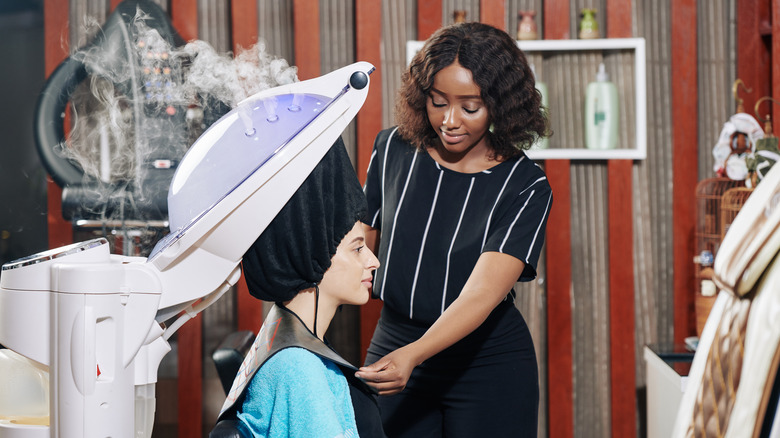 woman receiving salon steam treatment
