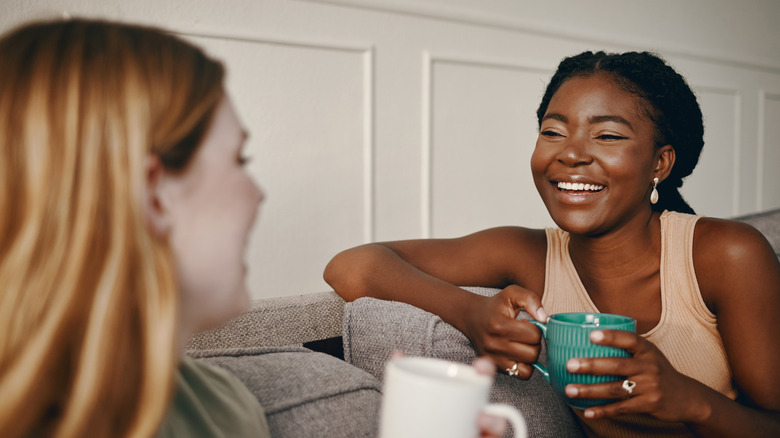 Friends converse on couch