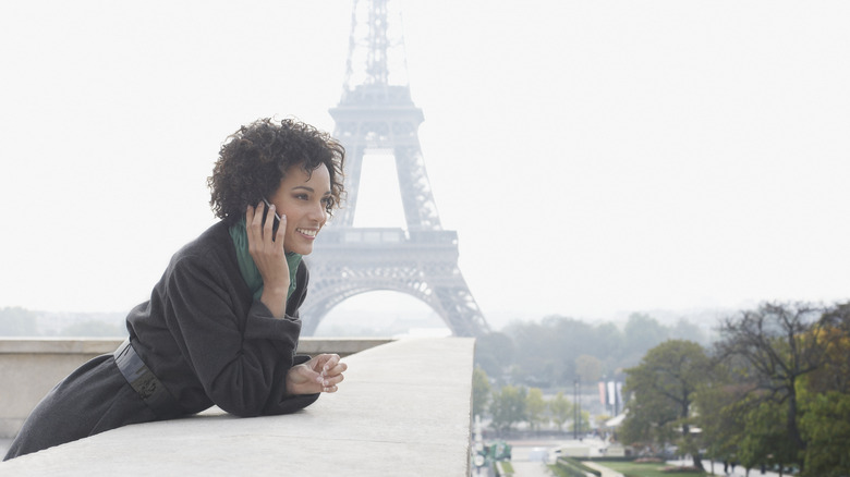 Woman on phone Eiffel Tower