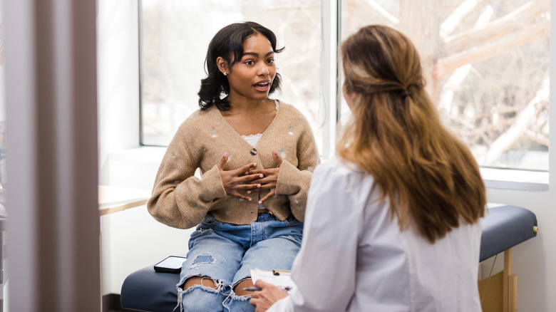 woman speaking to female doctor