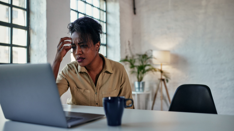 confused woman in online therapy