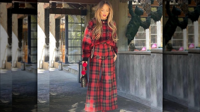 Woman in plaid head to toe.