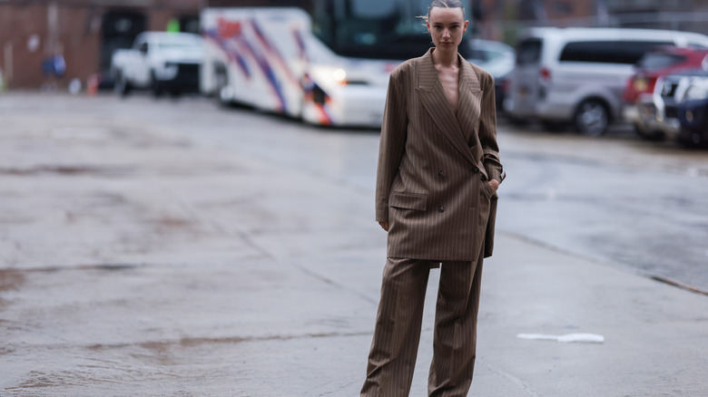 woman wearing brown pinstripe suit