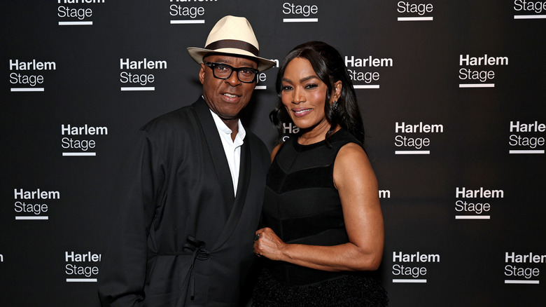 Courtney B. Vance and Angela Bassett wearing black outfits